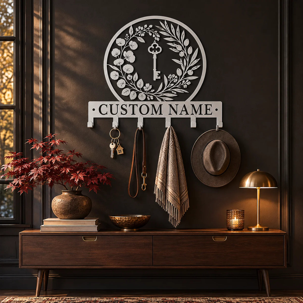 Personalized coat rack with custom name – Silver on a dark wall above a console