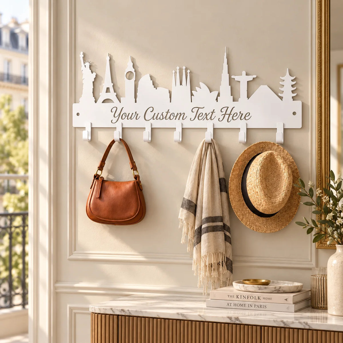Custom skyline metal coat rack – White in an entryway with a gold mirror